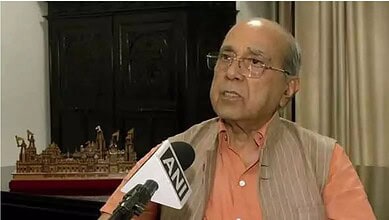 Senior man speaking into microphone with 'ANI' logo during interview.