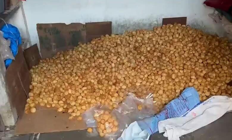 Large pile of discarded samosas and pani puris after raid in Hyderabad.