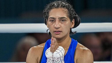 Preeti Pawar celebrates her victory in the boxing final at the Commonwealth Games.