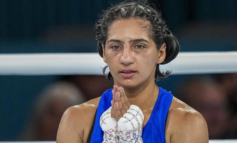 Preeti Pawar celebrates her victory in the boxing final at the Commonwealth Games.