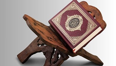 Quran placed on a traditional wooden stand, symbolising Islamic learning and spirituality.