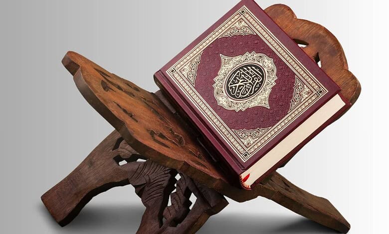 Quran placed on a traditional wooden stand, symbolising Islamic learning and spirituality.