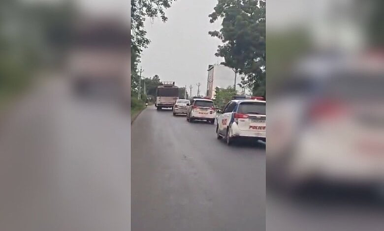 Traffic jam on a rainy day with multiple vehicles on a narrow road in Jagtial.