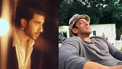 Two men outdoors, one with a hat, relaxed and enjoying the moment.