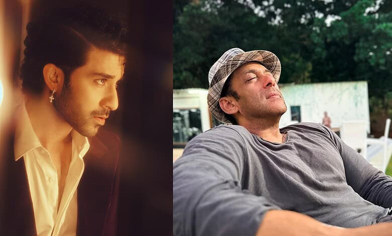 Two men outdoors, one with a hat, relaxed and enjoying the moment.