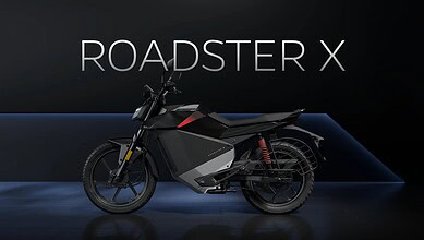 Ola Electric Roadster X electric motorcycle displayed on stage at launch event.