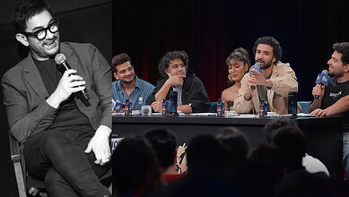 Samay Raina and panel discuss on stage at a live event, audience in foreground.