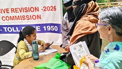 Elderly citizens and a young girl engaged in enumeration process in Hyderabad, India.