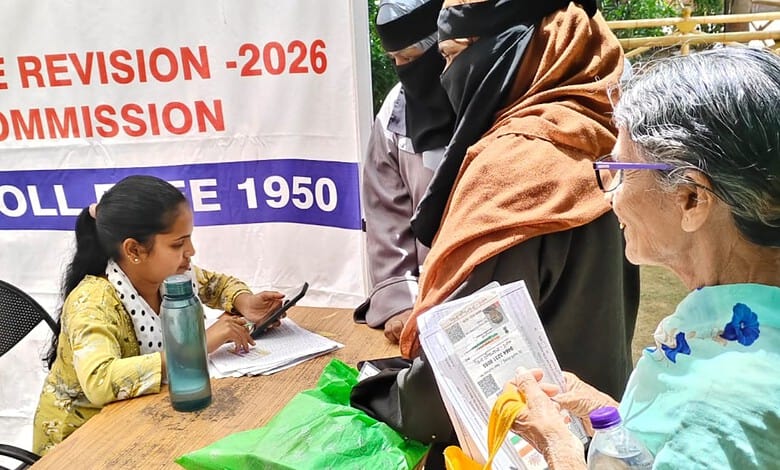 Elderly citizens and a young girl engaged in enumeration process in Hyderabad, India.