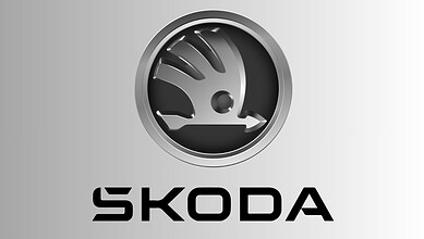 Skoda logo displayed prominently on a metallic surface, representing the automobile brand.