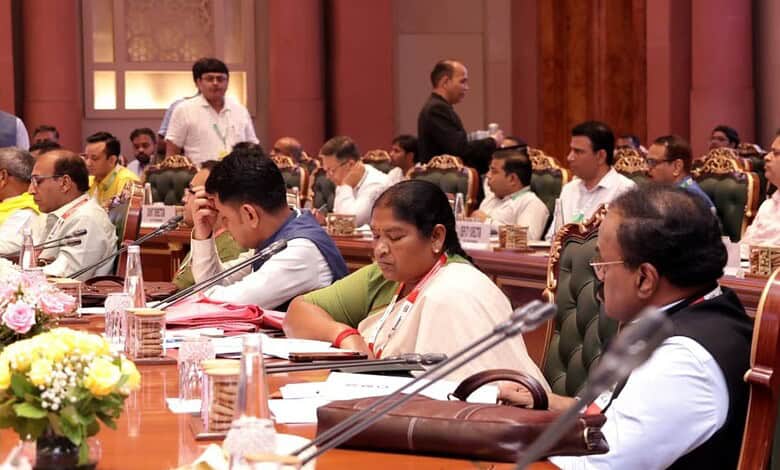 Members of parliament and officials attending a formal meeting on panchayat performance standards.