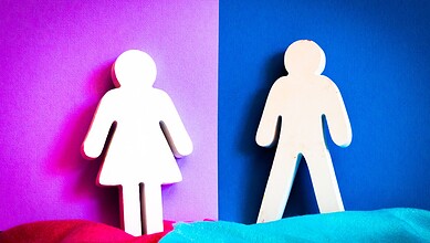 Gender symbols representing girl and boy on colourful background.