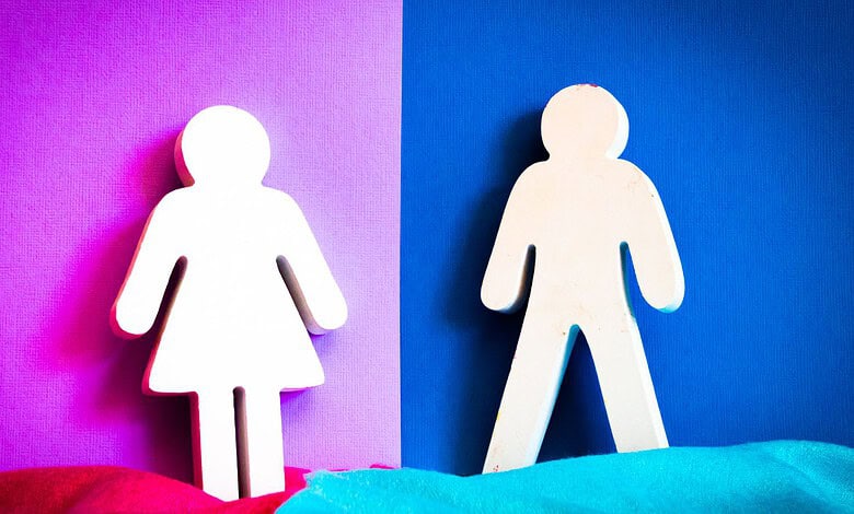 Gender symbols representing girl and boy on colourful background.