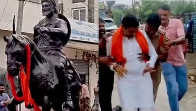 The image shows the police detaining Warangal BJP District President G Ravi Kumar when he tried to stop the police from removing Shivaji's statue from Bollikunta village on Friday, July 17, 2026.