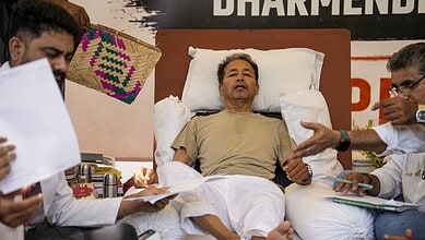 Sonam Wangchuk lying on hospital bed during indefinite fast protest in India.