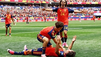 Spanish football players celebrating a goal during the FIFA World Cup match.