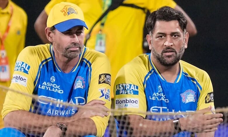 CSK coach Stephen Fleming with team members during a match, wearing yellow and blue jerseys.