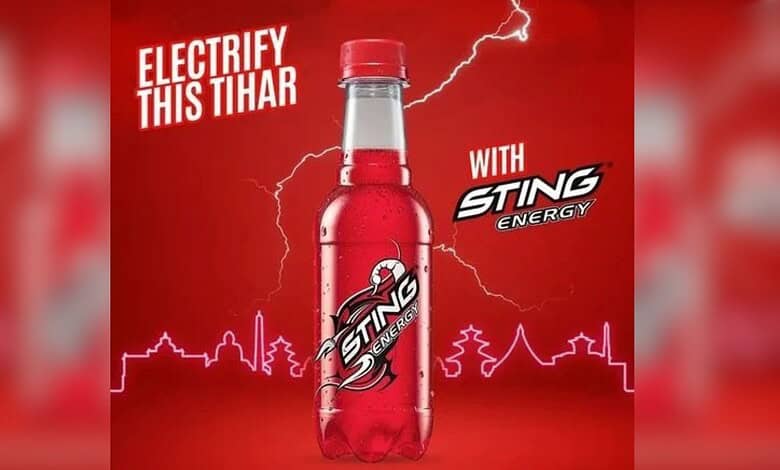 Sting Energy Drink bottle with lightning and Tihar festival theme in the background.