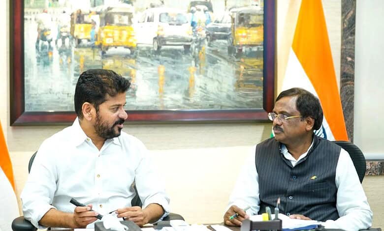 Two men in a formal meeting, discussing in an office with a painting and Indian flags in the background.