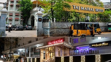 Exterior view of Taj Mahal Hotel and Taj Tristar with auto rickshaws in Hyderabad, India.