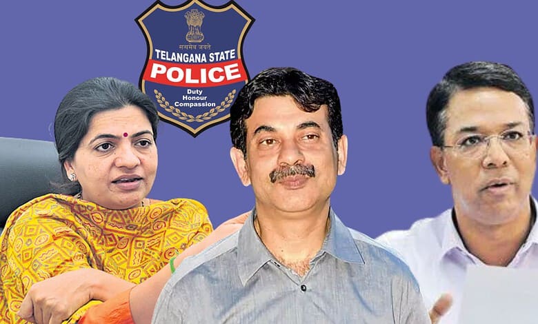 Telangana police officials discussing monsoon preparedness in front of police badge.