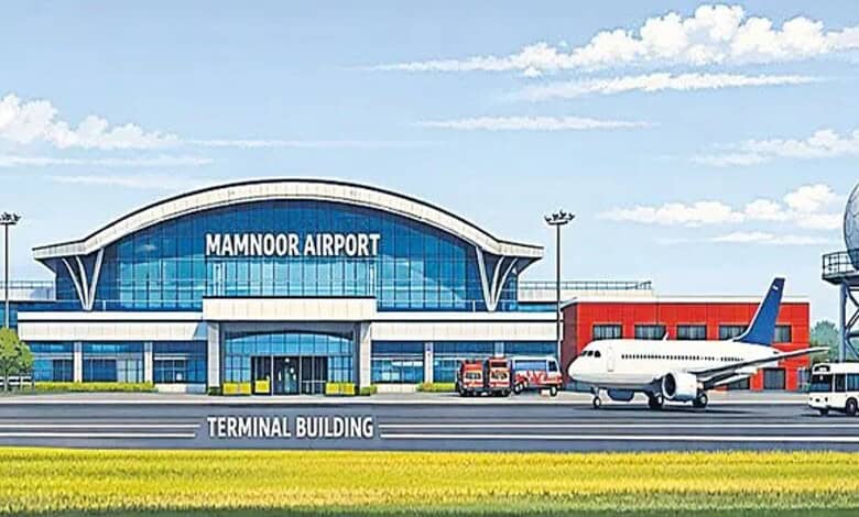 Modern Mamnoor Airport terminal with airplane and ground vehicles in front.