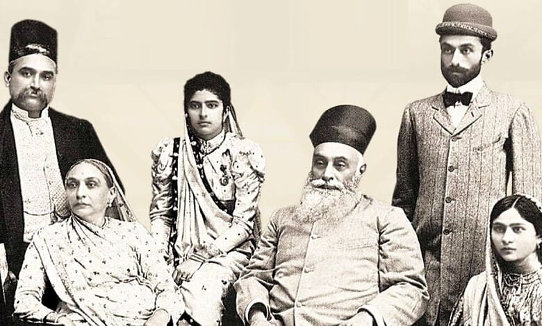 Historical photograph of a family in traditional Indian attire, including men, women, and children.