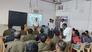 School bus staff attending traffic awareness training in Hyderabad classroom.