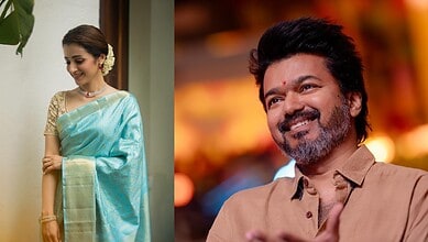 Smiling woman in traditional saree and man with beard in casual shirt, both happy.