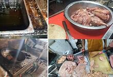 Dirty kitchen with oil spills and raw chicken on a red cutting board in Hyderabad restaurant.