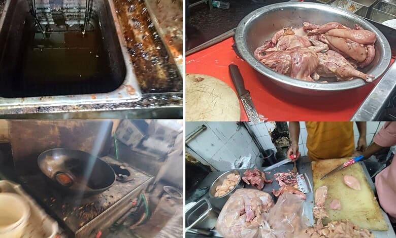 Dirty kitchen with oil spills and raw chicken on a red cutting board in Hyderabad restaurant.