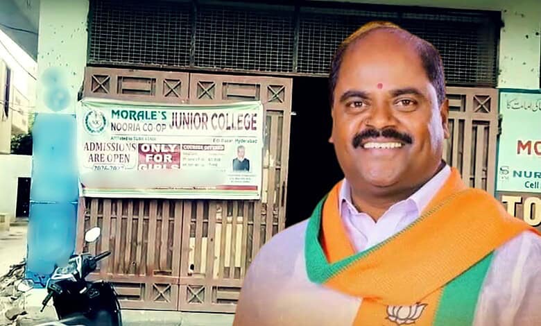 Smiling man in traditional attire standing outside a college building in Hyderabad.
