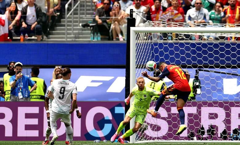 A Spanish player attempts a header