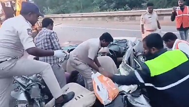 Police search a mangled car in Nalgonda