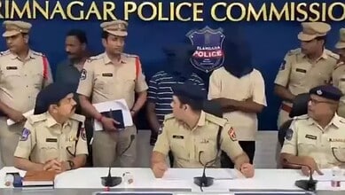 Police officers and a suspect at a press conference in Karimnagar, Telangana.