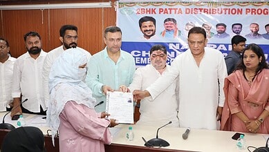 Officials and beneficiaries at the Indiramma scheme housing distribution event in Hyderabad.