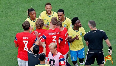 Brazil and Norway football players in a heated exchange during a match at the World Cup.