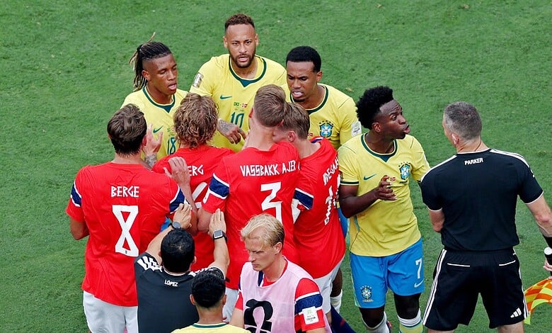 Brazil and Norway football players in a heated exchange during a match at the World Cup.