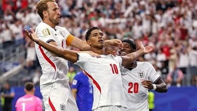 England players celebrating after scoring during the FIFA World Cup match against Mexico.