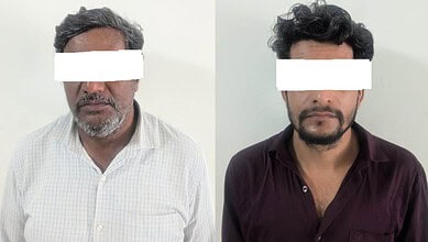 Two men with obscured eyes, one in a white checked shirt, the other in a dark maroon shirt.