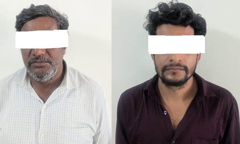 Two men with obscured eyes, one in a white checked shirt, the other in a dark maroon shirt.