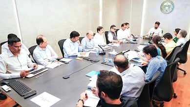Panel discussion on digital governance with diverse professionals in a modern conference room.