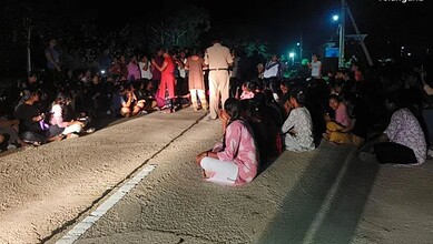 MG Univ hostel students protest against drinking water shortage at night.