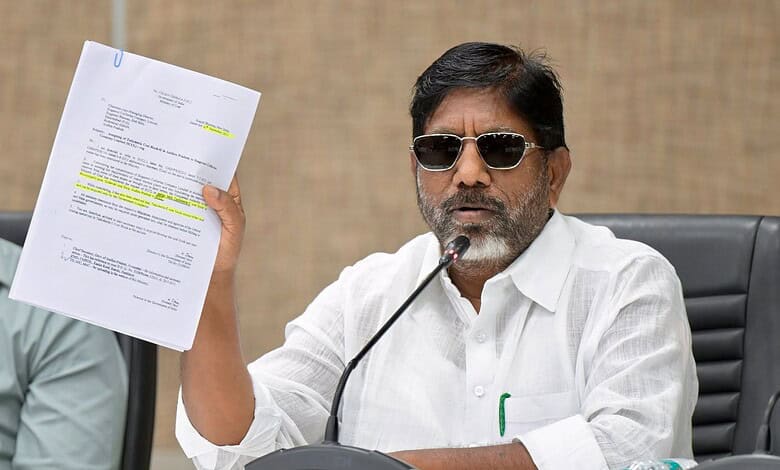 Man in white shirt with sunglasses holding a document during a press conference.