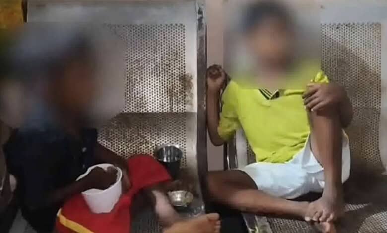 Two children sitting on a bench with burn marks, parents blamed, in Suryapet.