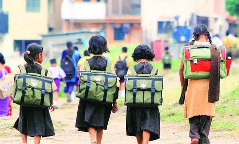 School children with backpacks walking outdoors during a school closure in Telangana.