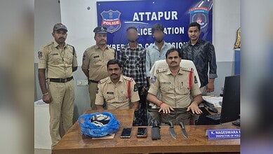 Police officers and suspects in a police station in Attapur, India.