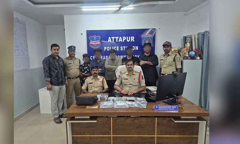 Attapur police officials and suspects during a drug bust at the police station.