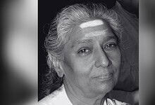 Black and white portrait of veteran playback singer S Janaki with a gentle smile.