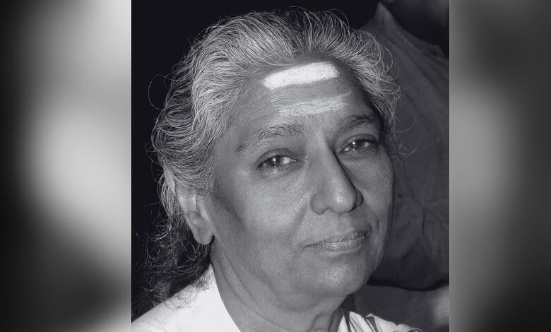 Black and white portrait of veteran playback singer S Janaki with a gentle smile.